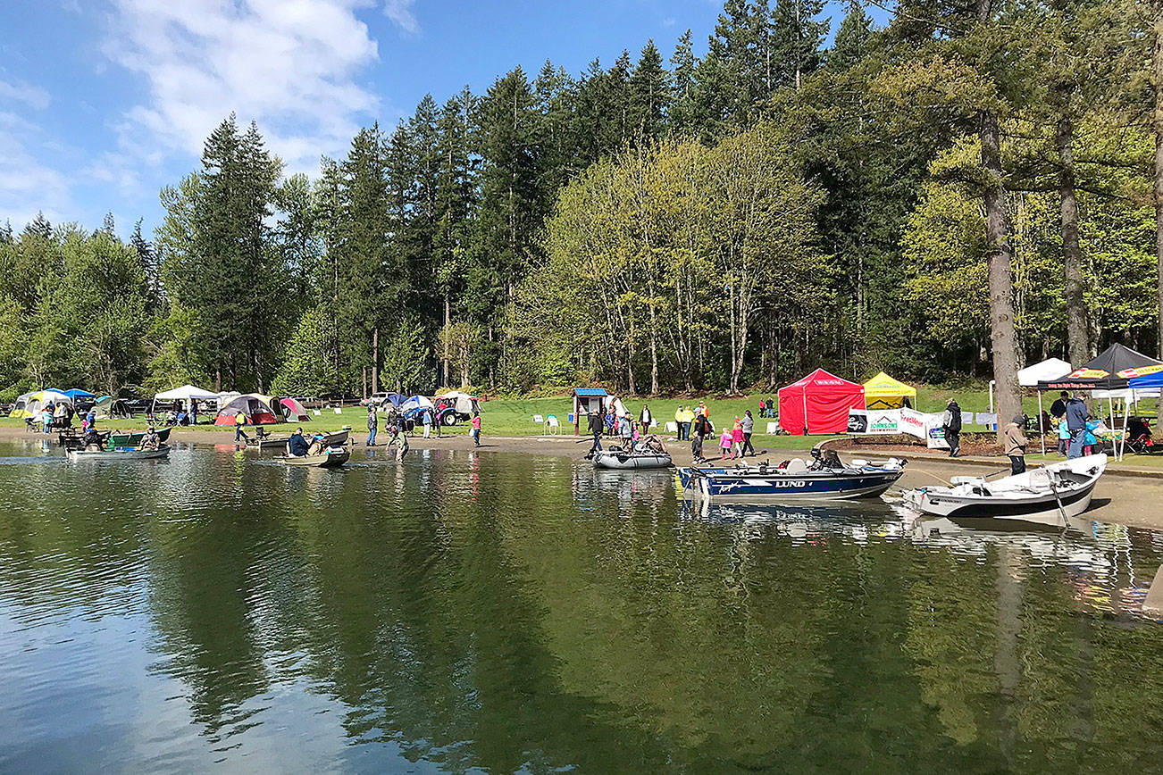 Fishing boats sit on the shore of Lake Wilderness during the Hooked On Fishing Derby. Photo by Kayse Angel