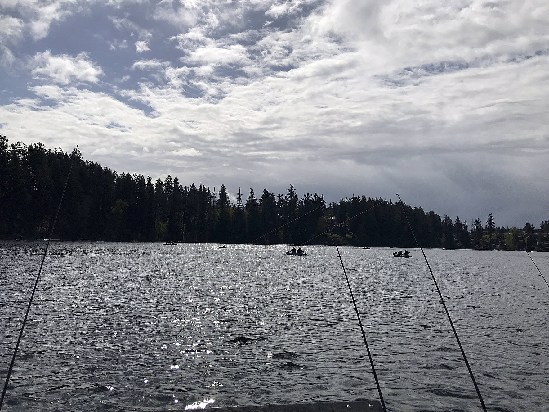 Fishers cast their fishing poles into Lake Wilderness on April 27 to catch some trout during the Hooked On Fishing Derby. Photo by Kayse Angel