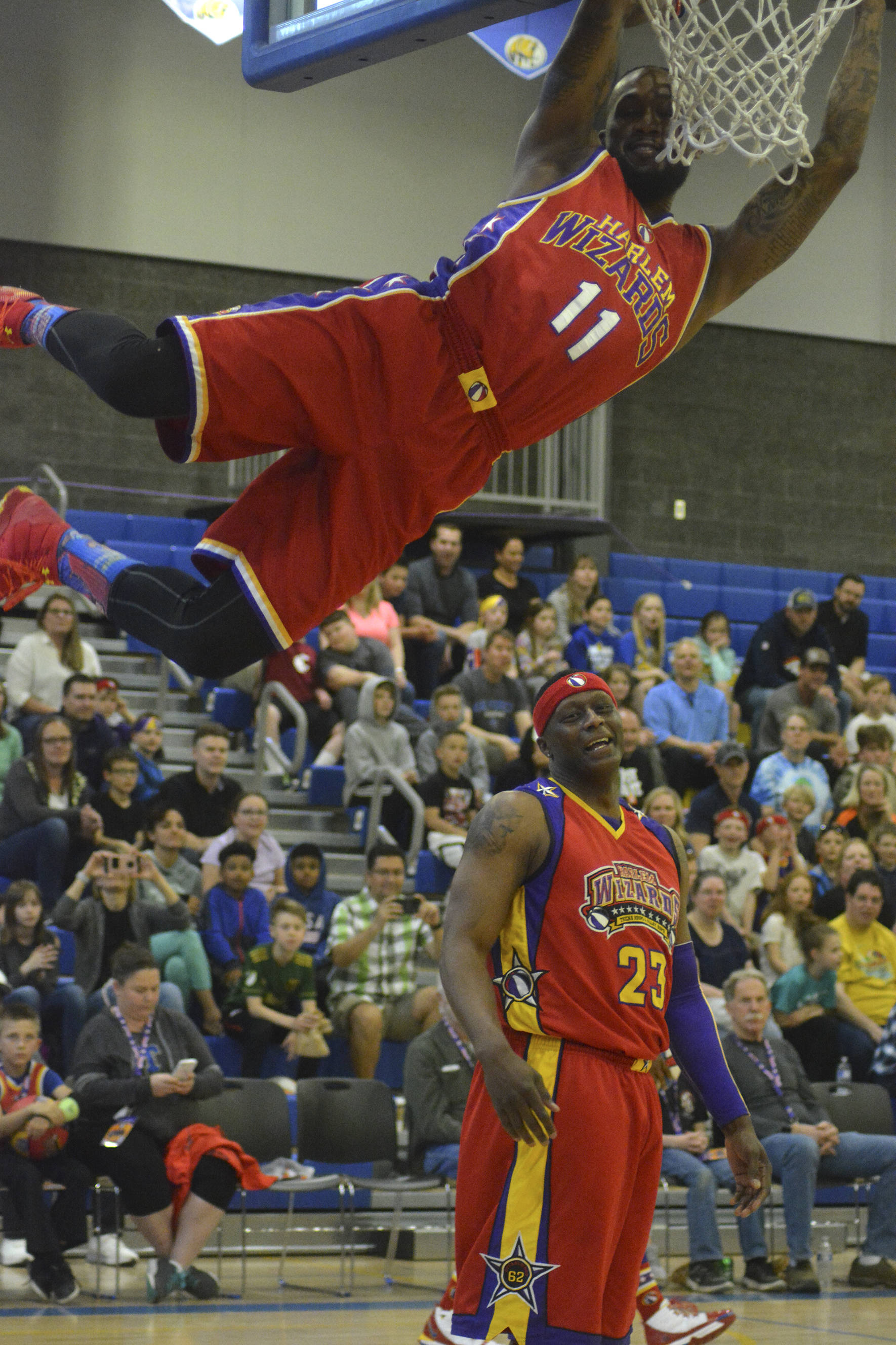 A Harlem Wizards player slam dunks a basketball during the fundraising event on May 3 at Tahoma High School. Photo by Kayse Angel