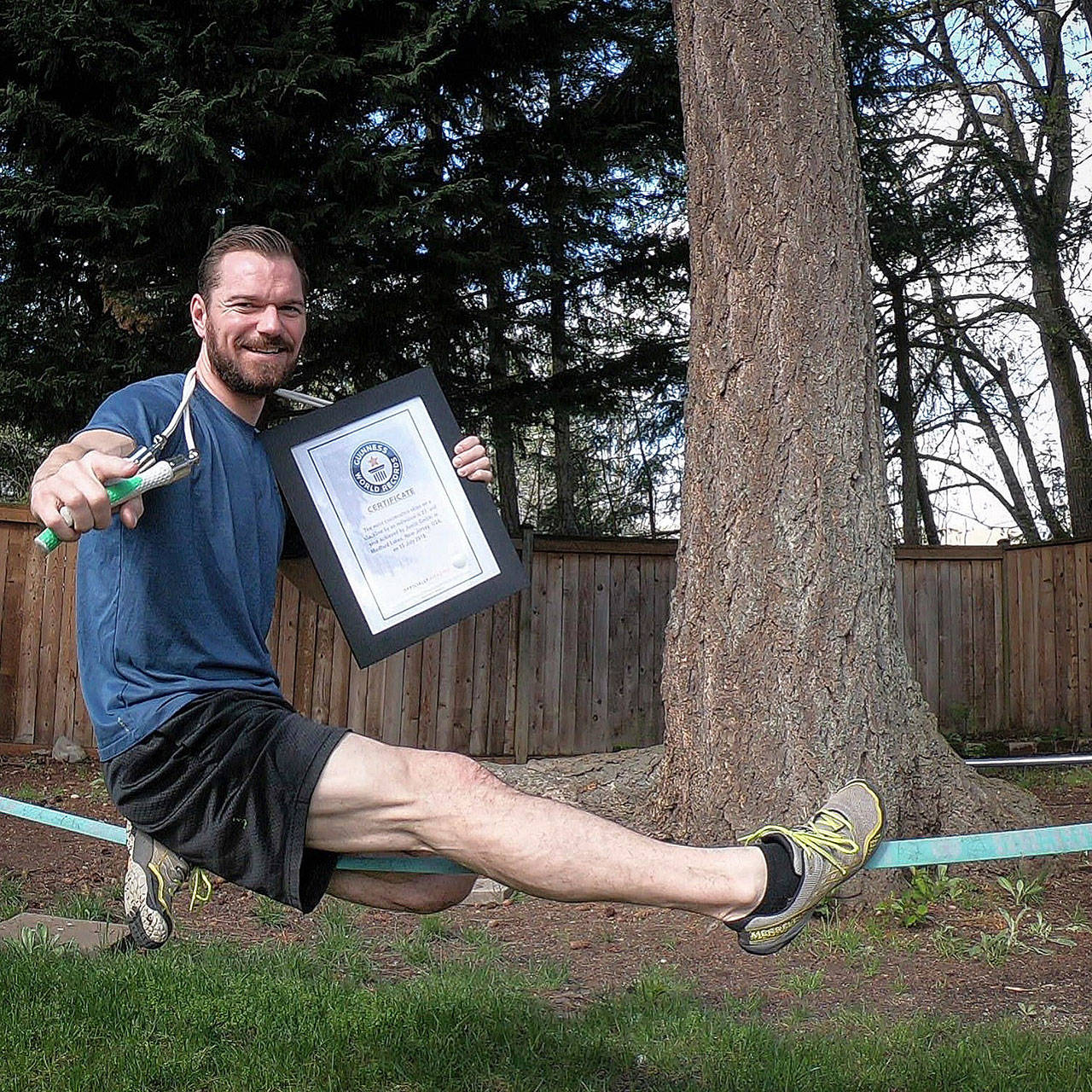COURTESY PHOTO                                 Maple Valley’s Justin Gielski holds his Guinness World Record certificate for doing the “most consecutive skips over a rope on a slack line,” a feat he says helped him earn a return appearance on NBC’s “American Ninja Warrior.”