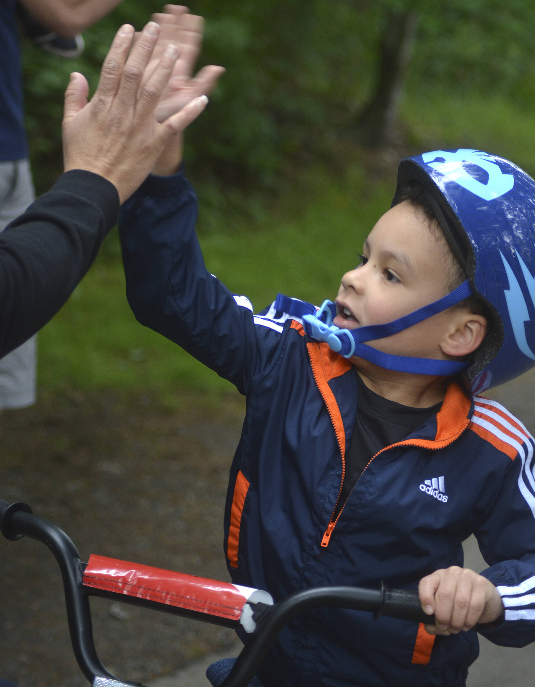 Photos by Kayse Angel                                 Kendri Larin rides to the finish line at the Maple Valley Bike Safety Rodeo and Bike Challenge that took place on June 22 at Lake Wilderness Park.