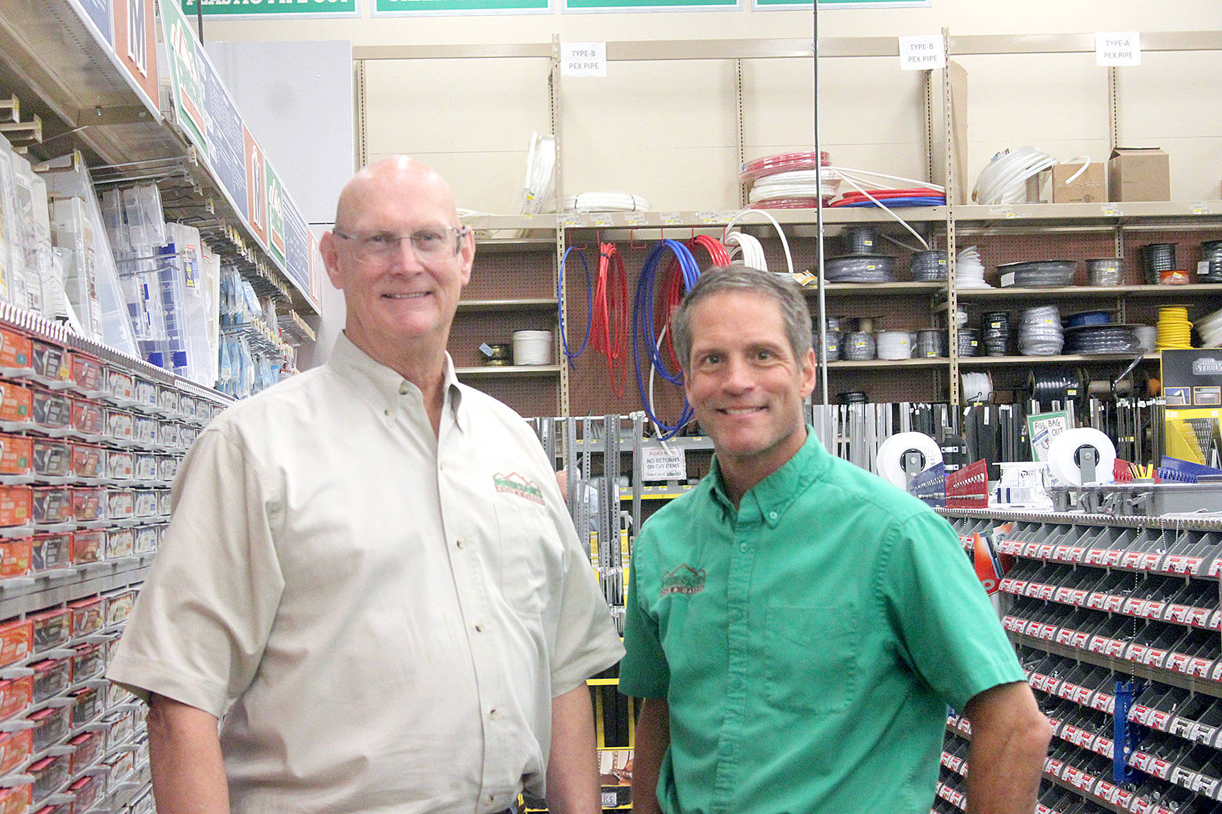 President of Johnson Home and Garden, Brad Johnson (right) stands with his uncle and vice president J. Johnson (left) near their large selection of fasteners. J. Johnson said the store has the largest selection of fasteners in the entire country. Photo by Danielle Chastaine