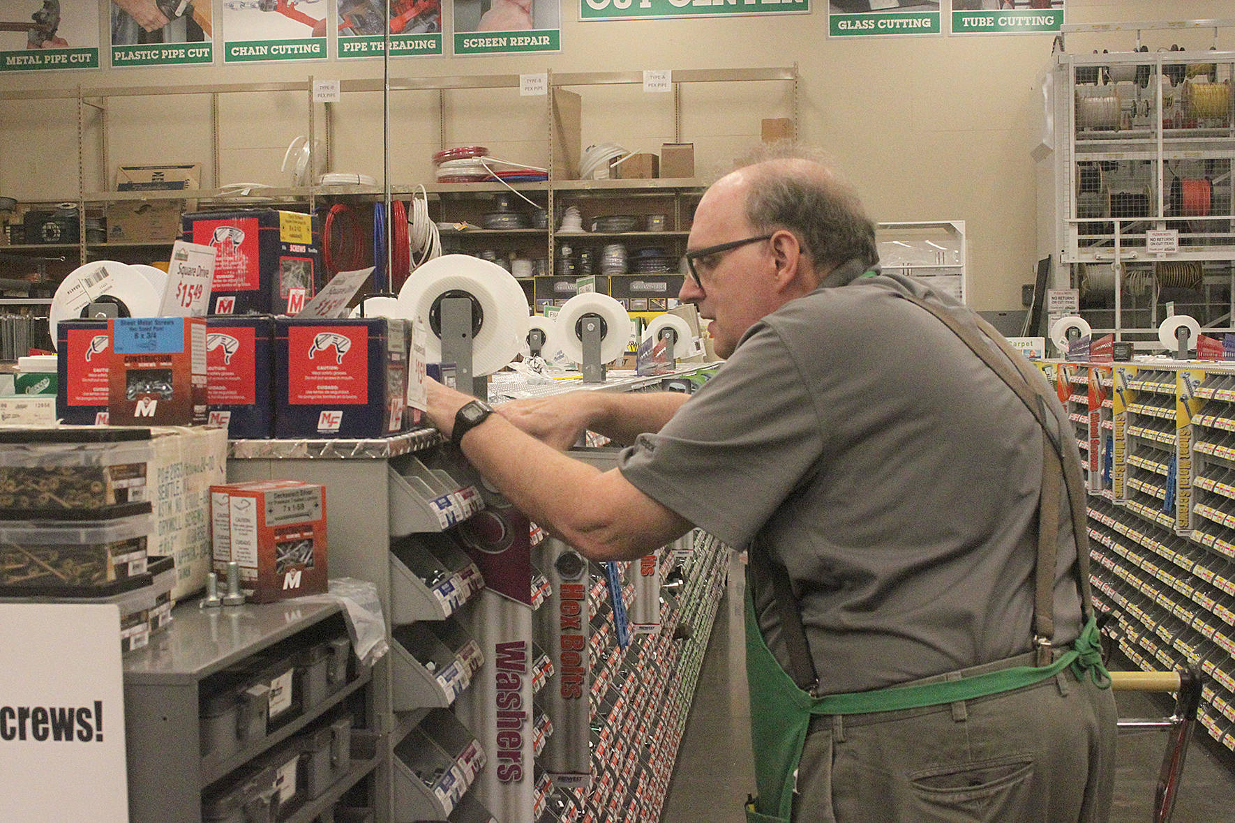 A Johnson Home and Garden employee works in the fastener department of the store. The Maple Valley business is about to celebrate 50 years of customer service. Photo by Danielle Chastaine