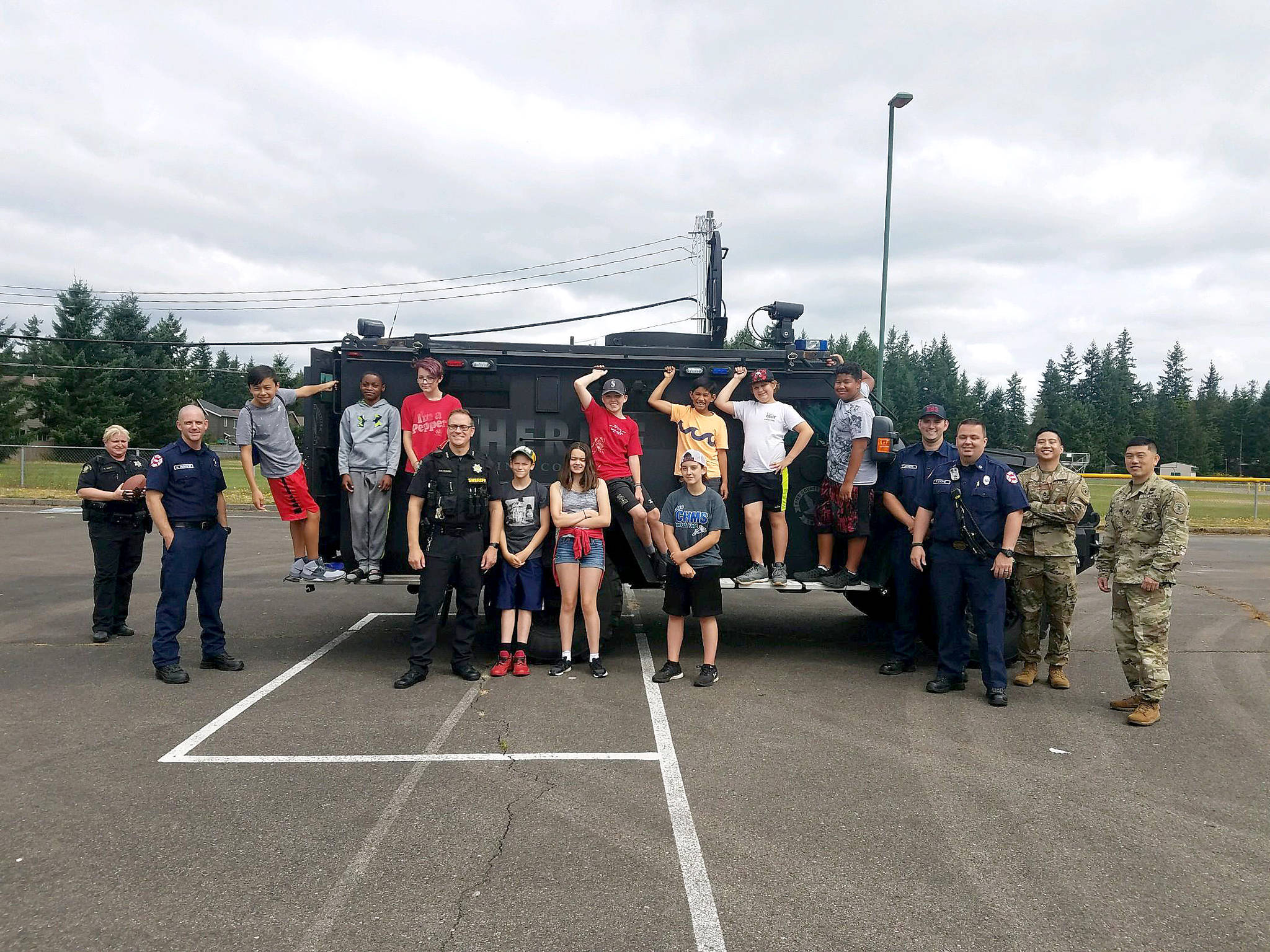 Photos by Danielle Chastaine.                                  Students in the Barbells and Badges summer camp at Cedar Heights Middle School compete on team firefighter or team police on Friday, Aug. 9. Photo courtesy of the Covington Police Department.