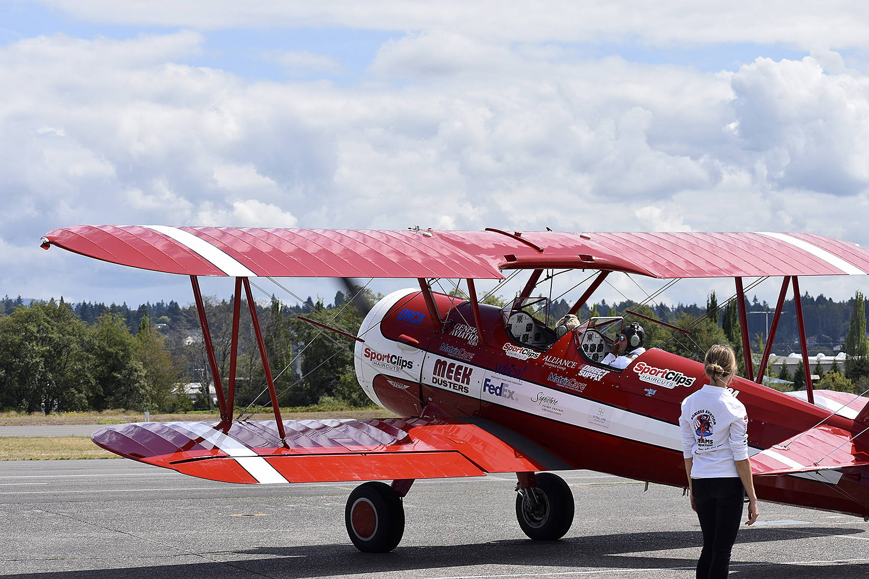 Photos by Haley Ausbun.                                 Seniors in nearby care facilities took flight in a 1942 Boeing Stearman biplane at Renton Municipal Airport, offered by Ageless Aviation Dreams Foundation.