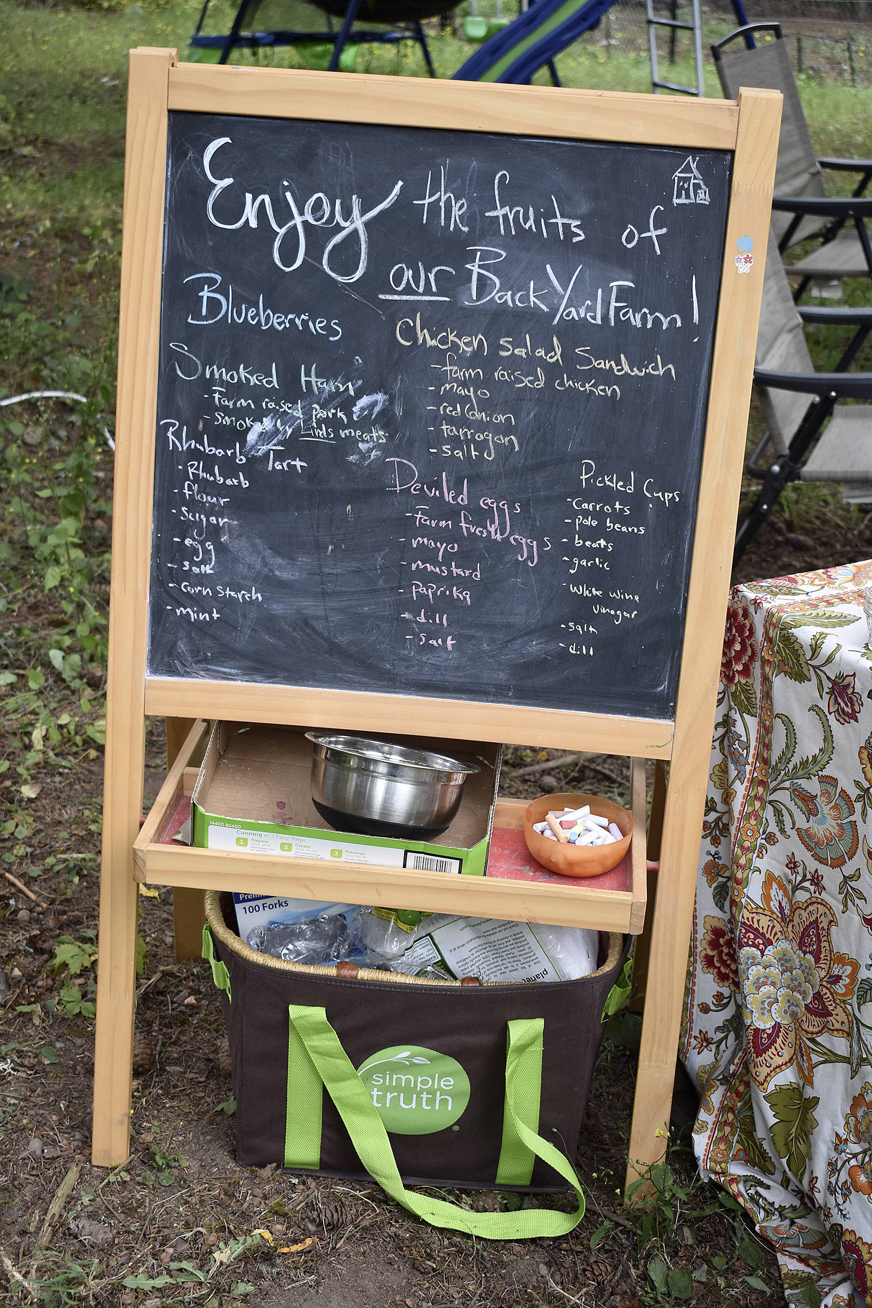 Photos by Haley Ausbun. The BackYardFarm, a local couple trying to help folks with small yards build their own farm, hosted an event July 27, where guests could meet the animals, feed the goats and eat food sourced from their own back yard.