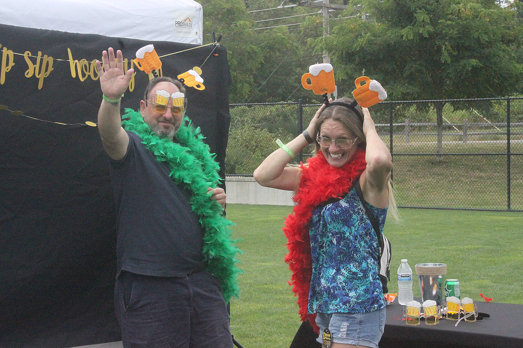 Couples tried on costumes for fun selfies at the 2019 Covington Sausage and Cider Fest.