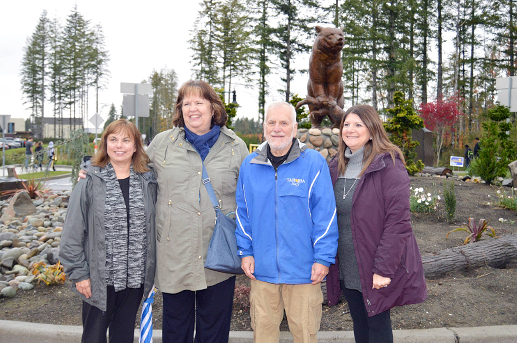 Former Tahoma School District Superintendent Mike “Papa Bear” Maryanski stands with district leaders after the bear statue at Tahoma High School was dubbed “Papa Bear” in gratitude for his service to the district. Photo courtesy of Tahoma School District.