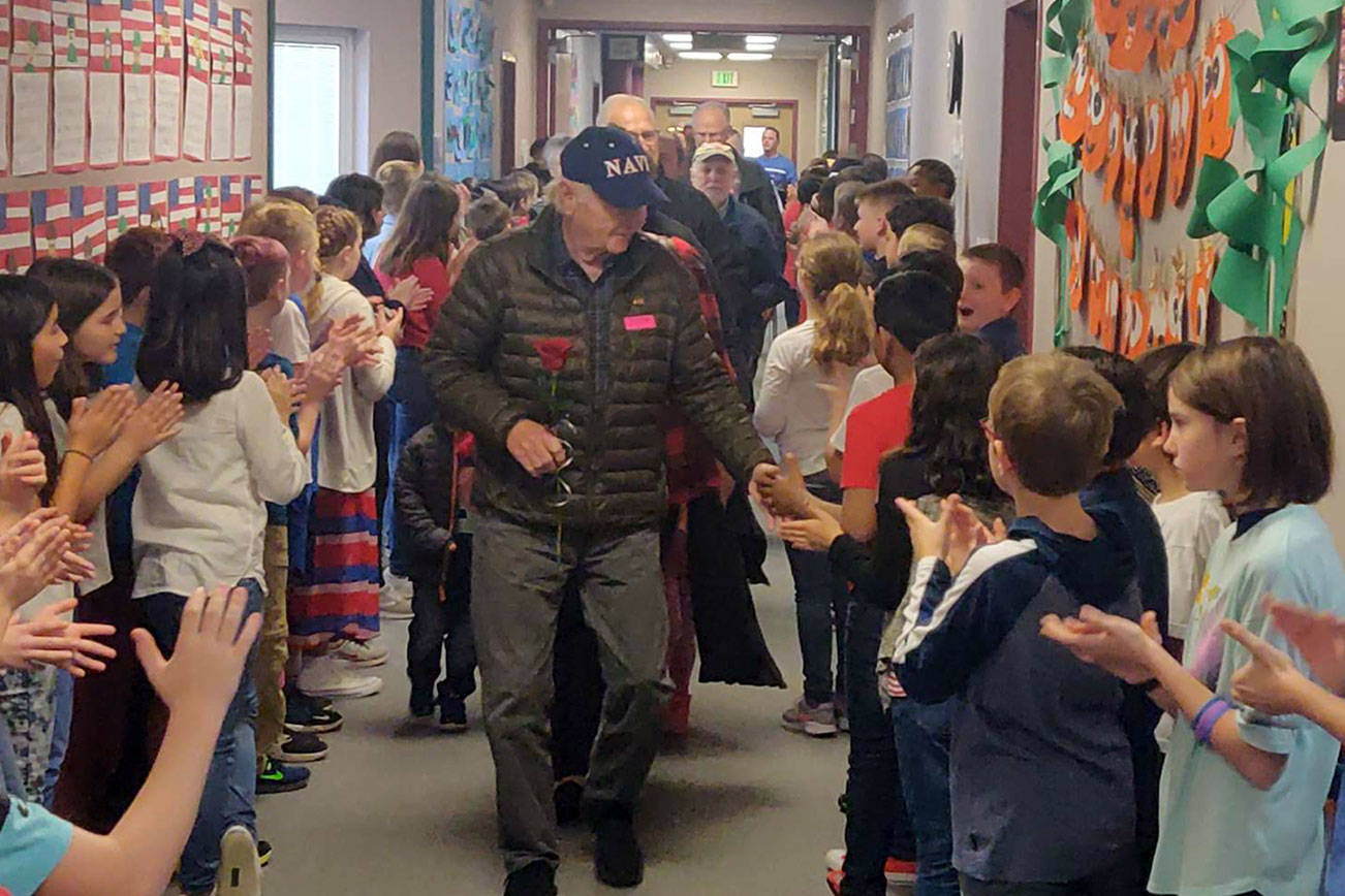 The Glacier Park Elementary School fifth grade class lined the halls after a special Veterans Day assembly to give high fives and applause to veterans, who were led through the halls after being honored by the school on Friday, Nov. 8, 2019. Photo by Danielle Chastaine.                                 The Glacier Park Elementary School fifth grade class lined the halls after a special Veterans Day assembly to give high fives and applause to veterans, who were led through the halls after being honored by the school on Friday, Nov. 8, 2019. Photo by Danielle Chastaine.                                 The Glacier Park Elementary School fifth grade class lined the halls after a special Veterans Day assembly to give high fives and applause to veterans, who were led through the halls after being honored by the school on Friday, Nov. 8, 2019. Photo by Danielle Chastaine.