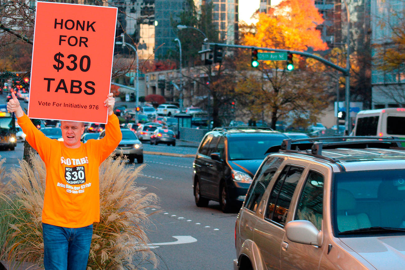 Political activist Tim Eyman campaigns for Initiative 976 on Nov. 5 in downtown Bellevue. The initiative promised $30 car tabs while functionally eliminating the ability of agencies like Sound Transit to raise taxes for its projects. Photo by Aaron Kunkler