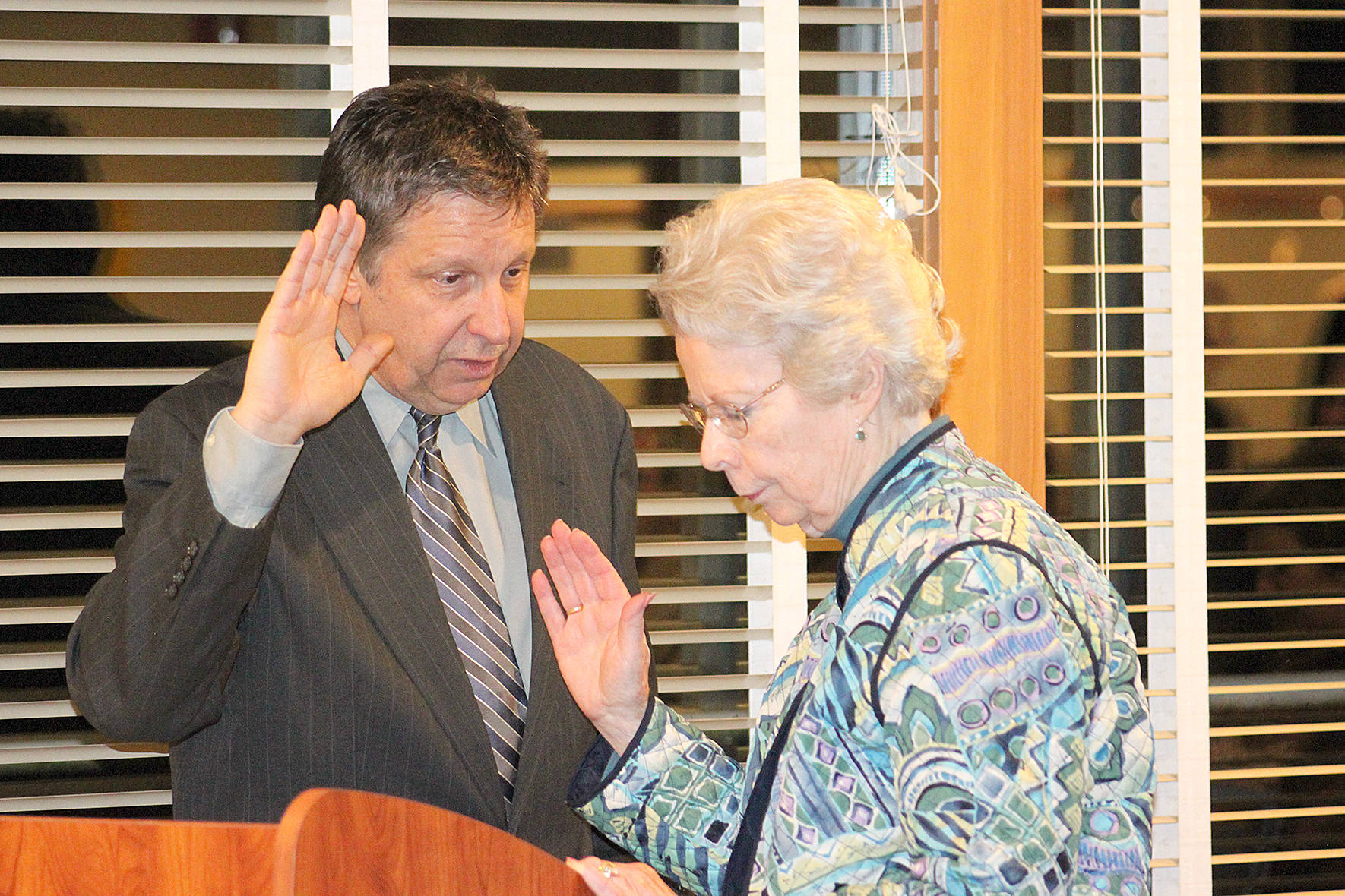 Maple Valley City Councilmember Linda Johnson takes the Oath of Office during the first council meeting on Monday, Jan. 6, 2019. Photo by Danielle Chastaine.