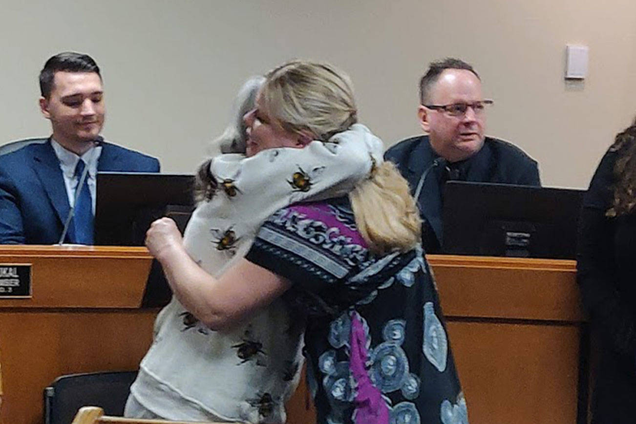 Debra Stevens, left, hugs Laura Mitchell, right, during the Covington City Council meeting on Monday, Jan. 27, 2020, where Mitchell was being honored for performing CPR and saving Stevens life on Dec. 19, 2019. Photo by Danielle Chastaine.