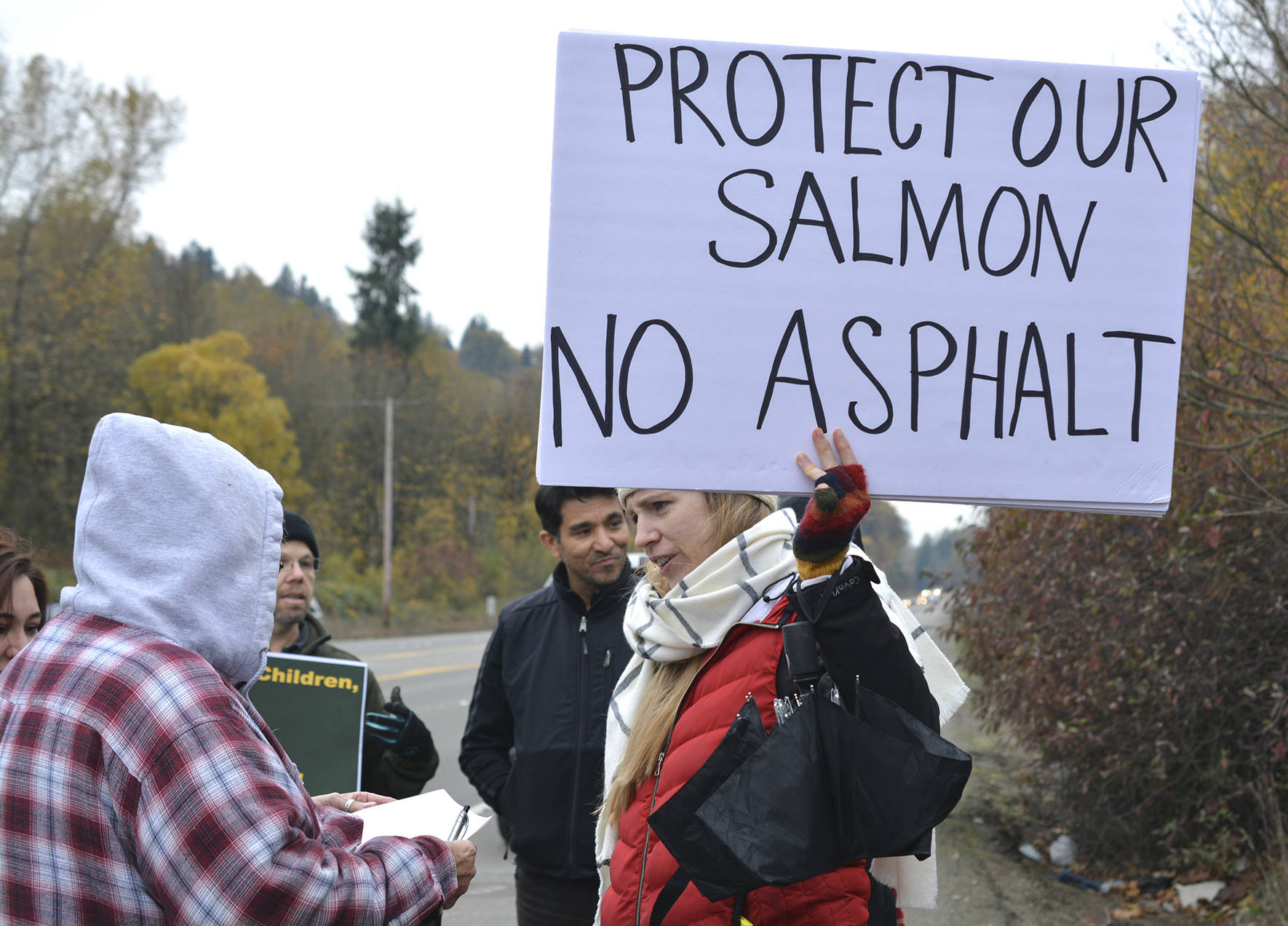 From the Reporter archive. Photo by Kayse Angel                                Protesters stand outside in the freezing weather on Nov. 4, 2017 to protest the proposed asphalt plant on Maple Valley Highway.