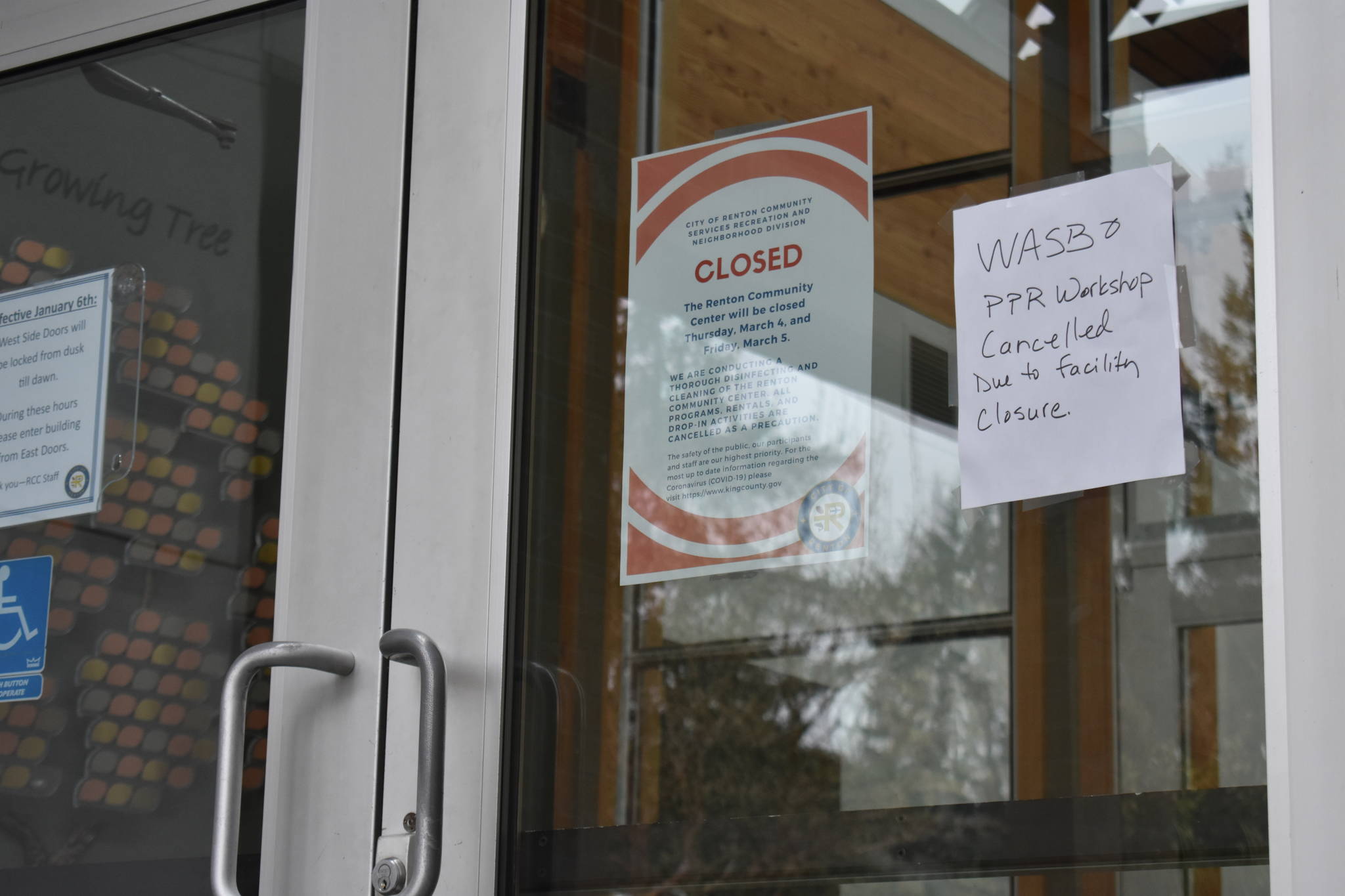 Photo by Haley Ausbun. The Renton Community Center, located at 1715 Maple Valley Highway, was closed until March 31 after the family of a preschooler in a program there told the city they had been exposed to a case of the novel coronavirus, COVID-19. Pictured: signage about the closure on the door of the center.