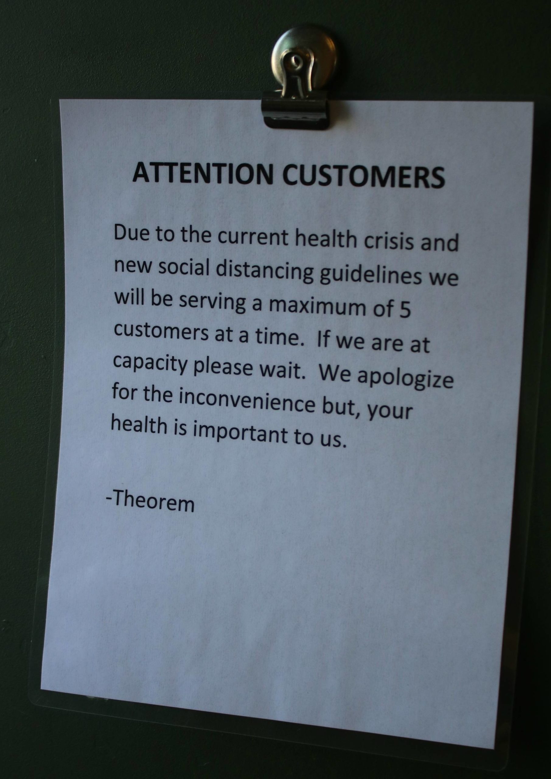 A sign on the front door at Theorem Cannabis in Kenmore. Andy Nystrom/staff photo