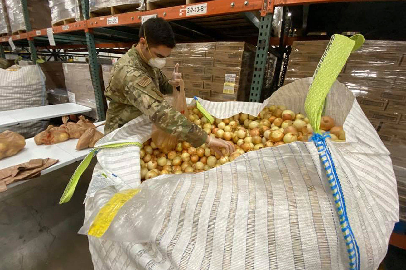The National Guard helps out at a Second Harvest food warehouse this month in Eastern Washington. National Guard members also are assisting at the Northwest Harvest warehouse in Kent. COURTESY PHOTO, Second Harvest