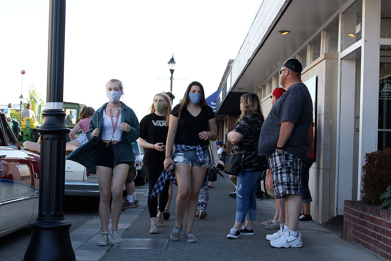 Some people wore face masks when the city of Enumclaw recently had a “downtown cruise” where people drove around downtown to order food from local restaurants. RAY MILLER-STILL, Enumclaw Courier-Herald