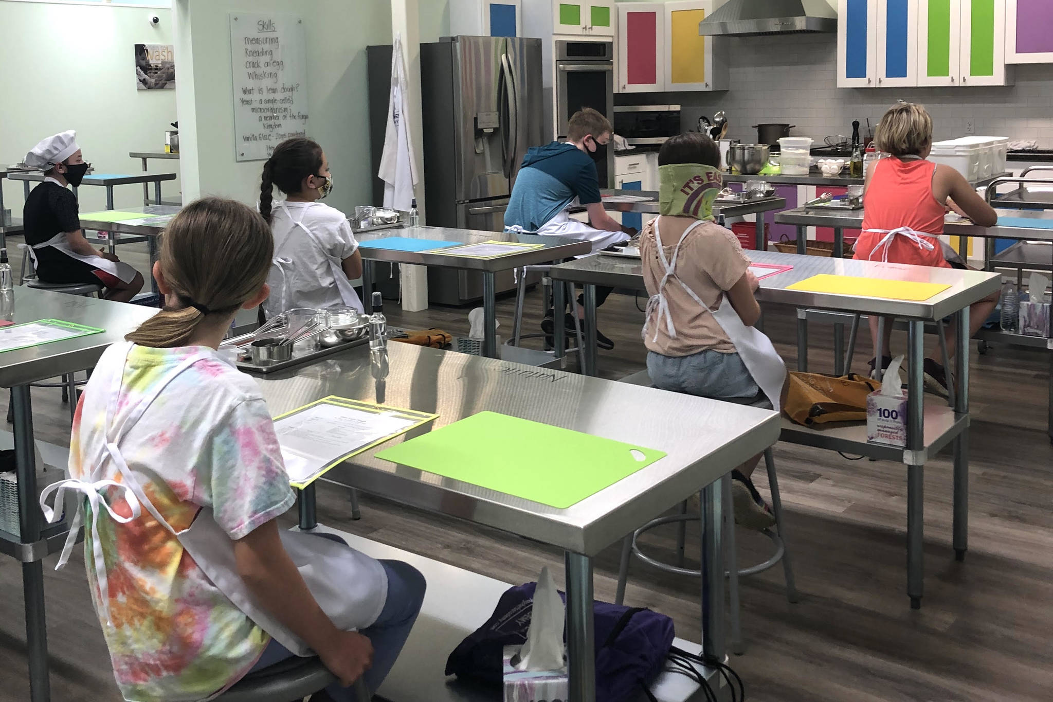 Kids find their stations for the first-ever cooking class at Young Chefs Academy Tuesday, June 23. The culinary arts school serves kids and teens in Covington and the surrounding areas. Courtesy photo/YCA Covington