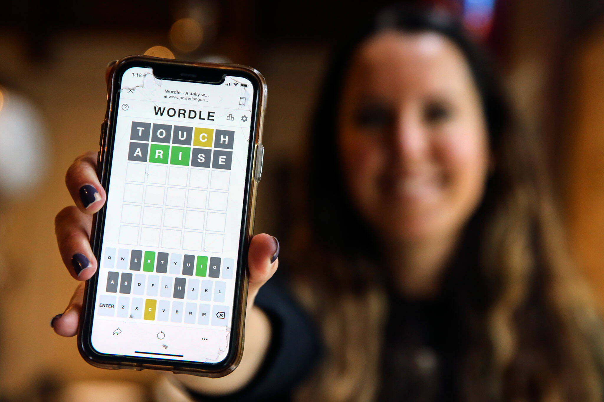 Christa Meyer, 41, a home health physical therapist, plays Wordle daily at her Mountlake Terrace home or on her lunch break between patients in her car. (Kevin Clark / The Herald)