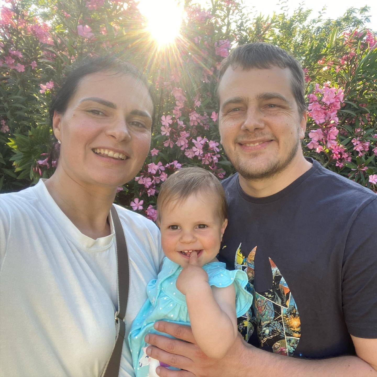 Valeriia Horodnycha and Sergey Polyakov hold their two-year-old daughter as they take a picture. Courtesy of Valeriia Horodnycha.