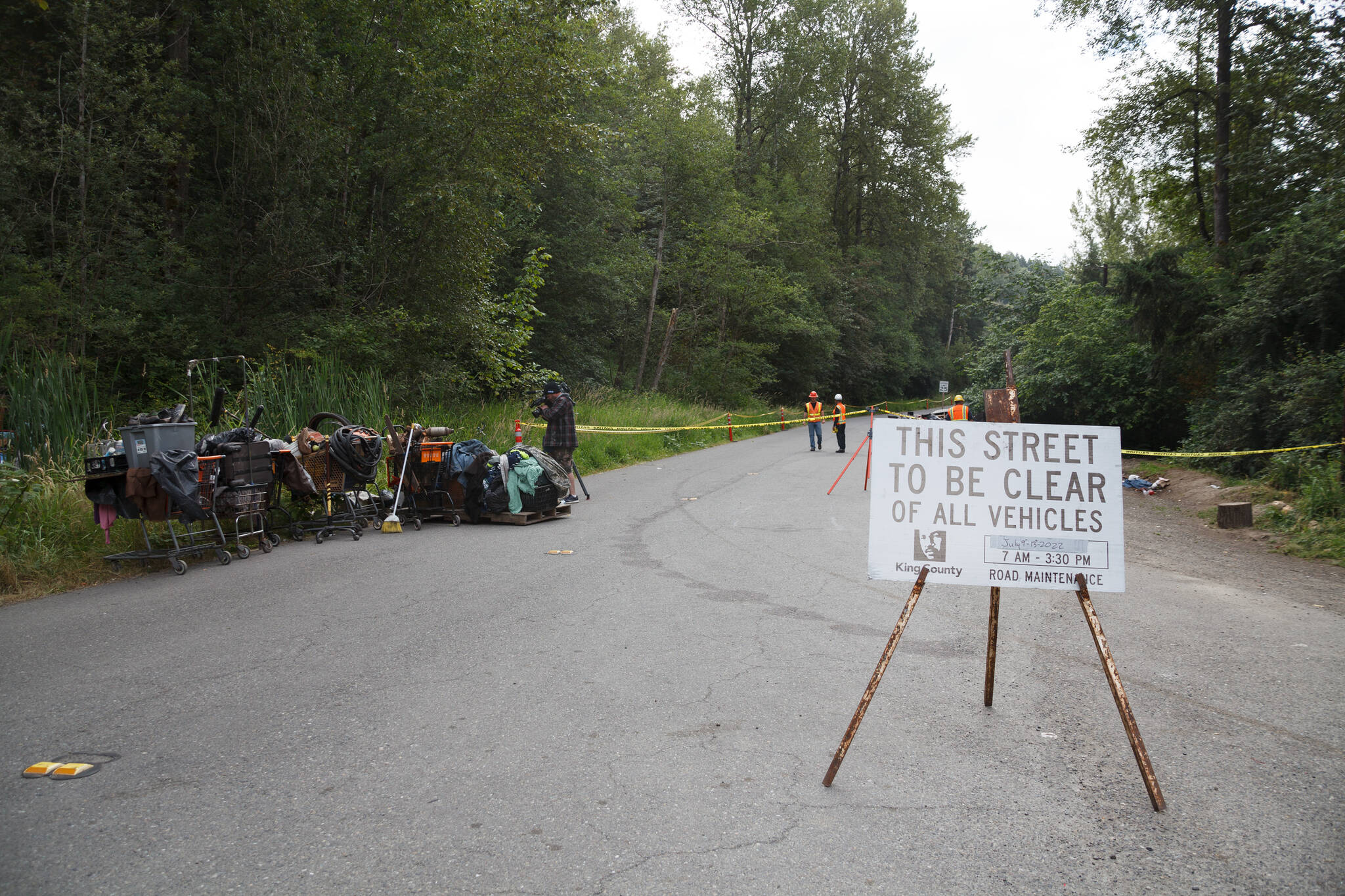 County workers cleaned trash and debris along the Green River Road in unincorporated King County. Henry Stewart-Wood/Sound Publishing