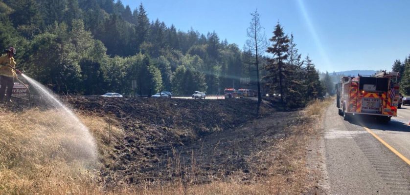 Eastside Fire and Rescue responds to a large brush fire July 25 on Interstate 90 near High Point Way east of Issaquah. Courtesy photo
