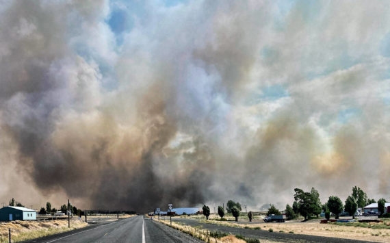 This photo provided by the Washington State Department of Transportation shows smoke from a wildfire burning south of Lind, Wash., on Thursday, Aug. 4, 2022. Sheriff’s officials are telling residents in the Eastern Washington town to evacuate because of a growing wildfire south of town that was burning homes. (Courtesy photo)