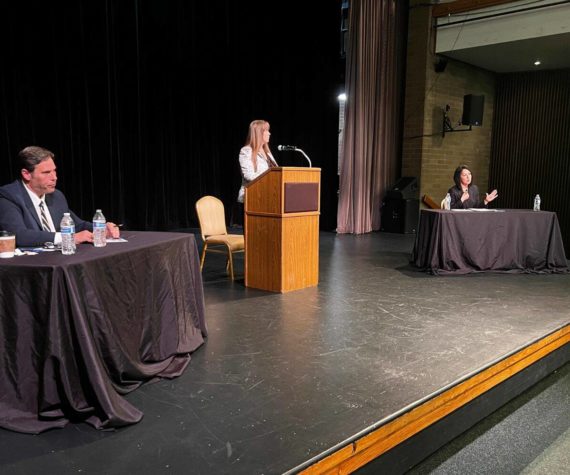King County prosecutor candidates Jim Ferrell (left) and Leesa Manion debate Sept. 28 at Carco Theatre in Renton. The forum was moderated by Renton Chamber of Commerce CEO Diane Dobson (center). Photo by Cameron Sheppard/Sound Publishing