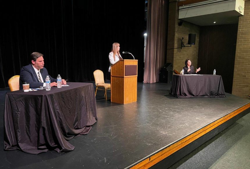 <p>King County prosecutor candidates Jim Ferrell (left) and Leesa Manion debate Sept. 28 at Carco Theatre in Renton. The forum was moderated by Renton Chamber of Commerce CEO Diane Dobson (center). Photo by Cameron Sheppard/Sound Publishing</p>