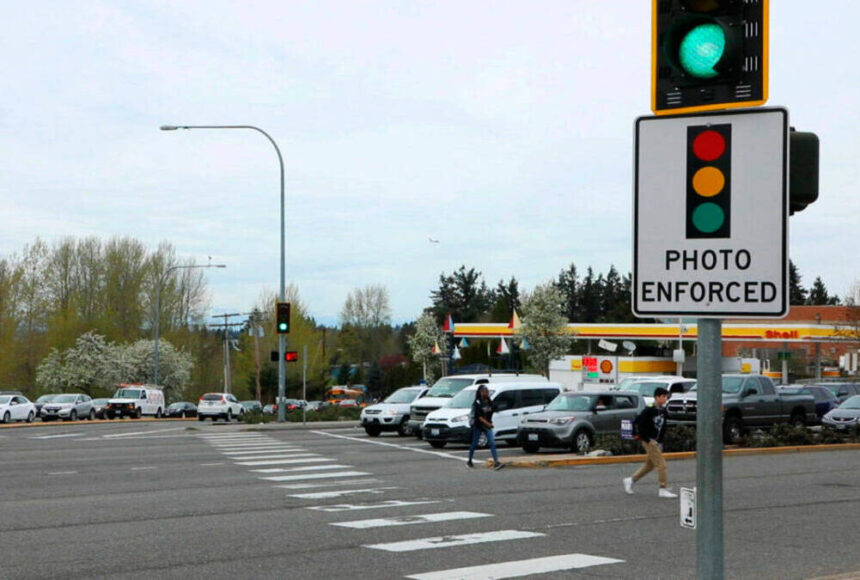 <p>A red-light camera sign at Pacific Highway South and Kent Des Moines Road in Kent. File photo</p>