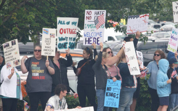 People rally June 14 in Covington during the first No Kings protest against the Trump administration. FILE PHOTO
