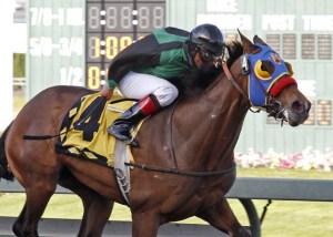 E Z Kitty and jockey Leonel Camacho-Flores lead all the way in the $50