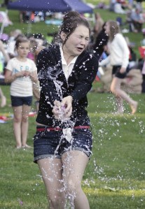 Liliya Odarchuk tries to make the catch during a water balloon toss during the city of Maple Valley’s Fourth of July celebration at Lake Wilderness Park. The toss was one of many activities offered during the event.