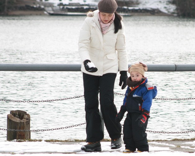 Crystal Ho helps her son Jason