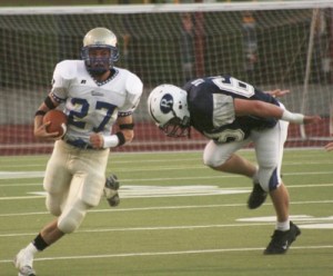 Jeff Thompson eludes an Auburn Riverside tackler Friday in the Bears 50-24 victory.