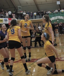 The team celebrates a momentous points during their match against Snohomish Friday.