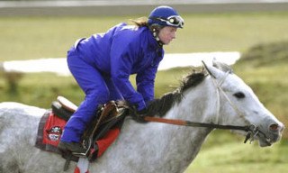 Jennifer Whitaker exercises filly “Hint of Lavender.”  Last August Whitaker won the Longacre Mile on Wasserman