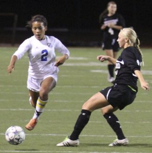 Tahoma’s Brie Hooks dribbles the ball while Kentwood’s Jennifer Oak defends in a Sept. 29 match at Bill Maxwell Stadium. Tahoma