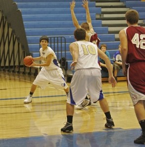Tahoma's Ethan McCormack dishes it to Taylor Summerhays that lead to two points against Cascade Bruins