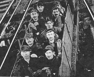 Black Diamond miners ride the car down into the mine. The car was lowered by a cable.