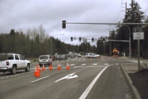 A Maple Valley police officer is stationed at the barricade this morning at Southeast 231st Street and Maple Valley Highway. State Department of Transporation officials closed the state route early in the morning due to water over the road at Cedar Grove Road.