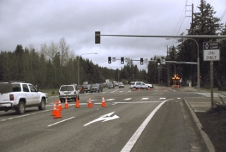 A Maple Valley police officer is stationed at the barricade this morning at Southeast 231st Street and Maple Valley Highway. State Department of Transporation officials closed the state route early in the morning due to water over the road at Cedar Grove Road.
