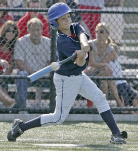Cody Faulkner of the Kent Little League 9-10 All Stars starts the scoring in the title game with at triple at the top of the third inning and gets bunted in by Travis Hansen to put up the first run.  Kent beat Gig Harbor 3-2 July 25 .