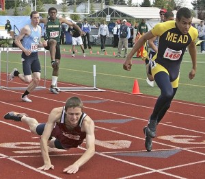 The dive from Kentlake hurdler Shad Hall came up just a little bit short against Mead’s Wes Bailey during the Class 4A state track & field meet at Mount Tahoma High two weeks ago. Despite finishing just a whisker shy of capturing the state title