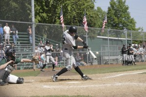 Kentwood's Skyler Genger gets his bat on the ball in the win over Edmonds-Woodway Saturday at Kent Memorial Park.