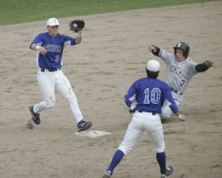 Jerad Casper covers for Tahoma as Kentwood's Robbie Morris slides in and Taylor Smart backs up the play
