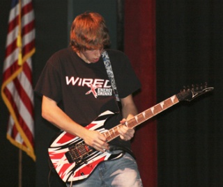 Branden Balles plays lead guitar for Blue Armada