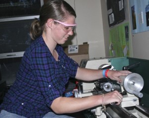 Taylor Dowell works on a lathe Jan. 28 in the Bear Metal Tahoma High robotics club. The students are building a robot for the FIRST