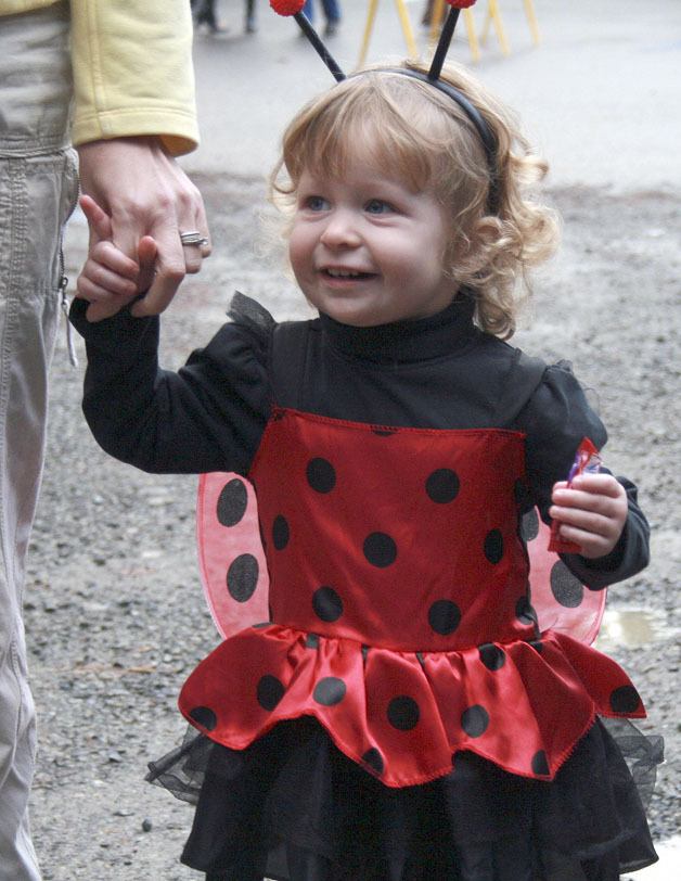 1-year-old Josephine Koszegi looks on at the Trick or Trucks event held at the Maple Valley Community Center Oct. 31.