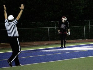 Kentlake's Caleb Mathena stands in the endzone after running in a 31 yard  interception Thursday